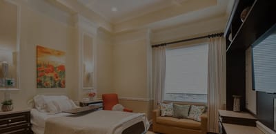 Cozy private room with a bed and seating area
