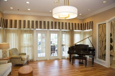 Bright lobby area with piano and seating