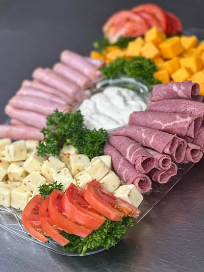 Platter of assorted meats, cheeses, and vegetables