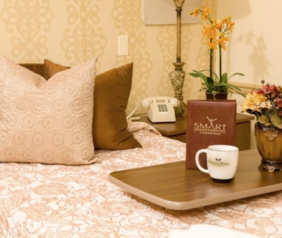 Cozy resident room with floral decor and coffee