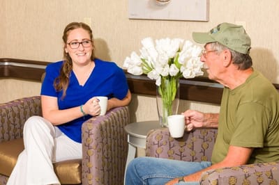 Staff member chatting with a resident in a common area