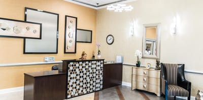 Reception area with staff member at the front desk