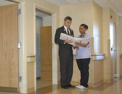 Staff discussing in a hallway of the facility