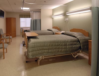 Private resident room with two adjustable beds