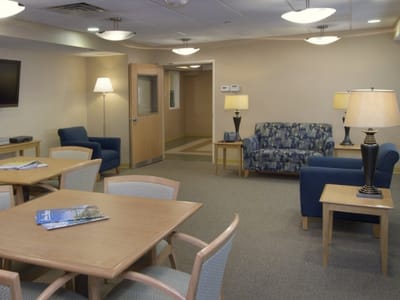 Common area with seating and tables in a warm tone