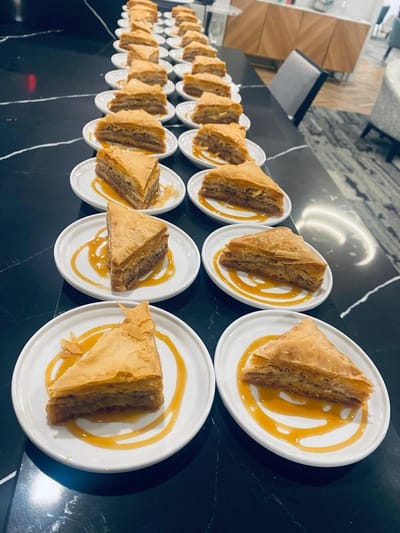 Plates of baklava arranged on a table