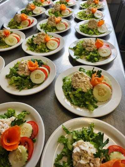 Plates of food prepared for meal service