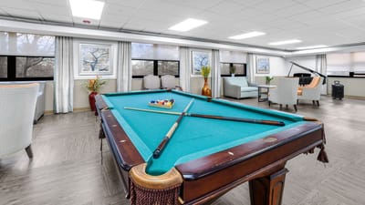 Interior common area with a pool table and seating