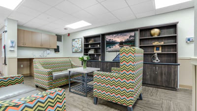 Bright common area with colorful seating and decor