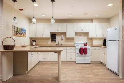 Bright kitchen area with modern appliances and cabinetry