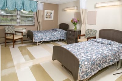 Shared resident room with two beds and furniture