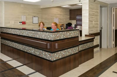Staff at the reception area helping residents