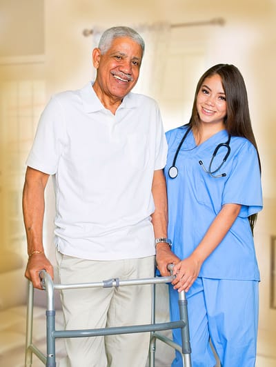 A caretaker assisting an elderly resident indoors