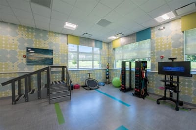 Bright activity room with fitness equipment and colorful decor