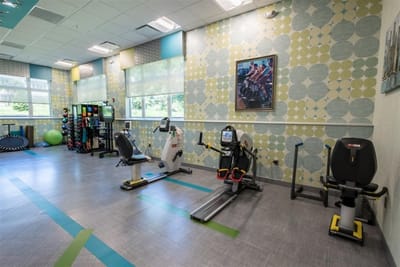 Well-equipped fitness room with exercise machines