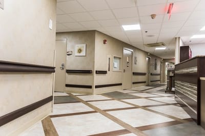 Hallway with nursing station and resident doors