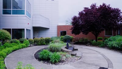 Well-maintained garden and seating area outside the facility