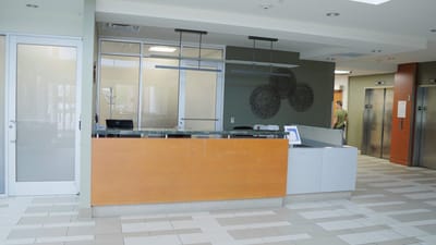 Reception area with a modern design and staff member