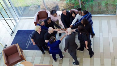 Staff and residents engaged in a team-building activity