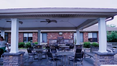 Outdoor patio area with tables and chairs