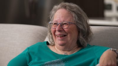 Smiling resident enjoying time in a cozy setting