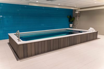 Indoor spa area with a water feature and towels