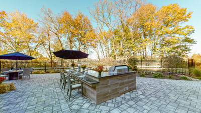 Outdoor patio area with seating and trees