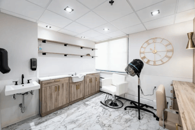Interior view of a hair salon with styling equipment