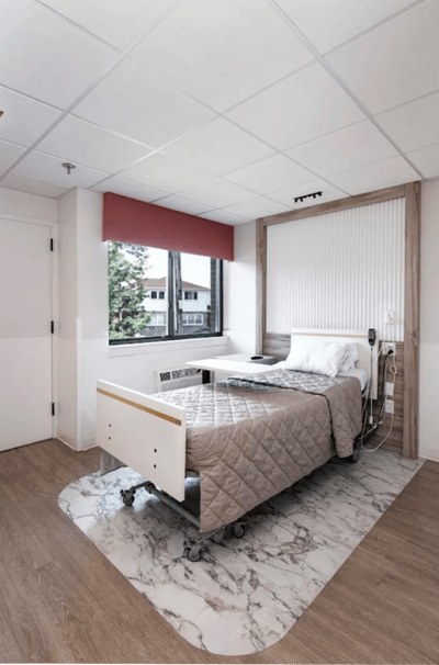 Private resident room with a bed and window