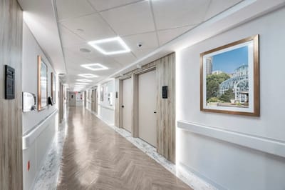 A brightly lit corridor in a senior living facility