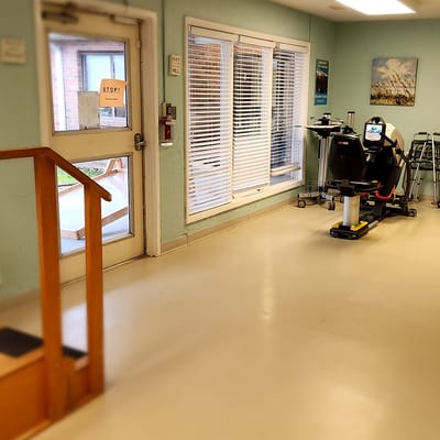 Interior space featuring therapeutic equipment and accessibility aids