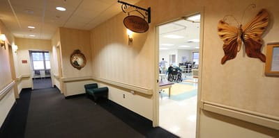 A hallway leading to the therapy suite in the facility