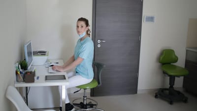 Staff member working at a desk in a facility