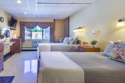 Interior view of a resident room with two beds