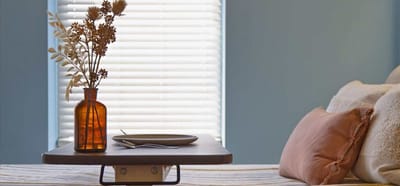 Dining setup with a vase and plate on a table