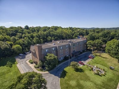 Aerial view of the assisted living facility surrounded by greenery