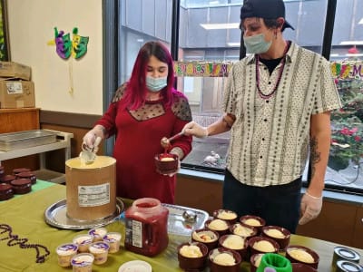 Sunnyside Care Center, Nursing Home in East Syracuse, NY — Volunteers serving dessert in a dining area