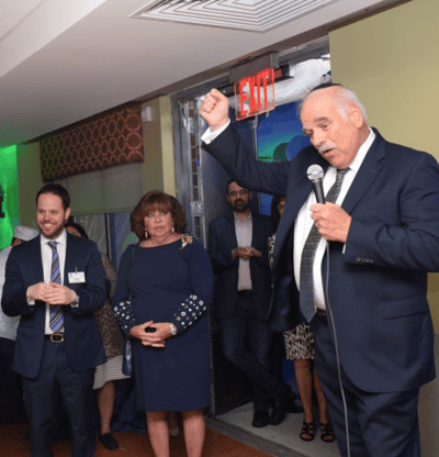 Group of people at an event with a speaker