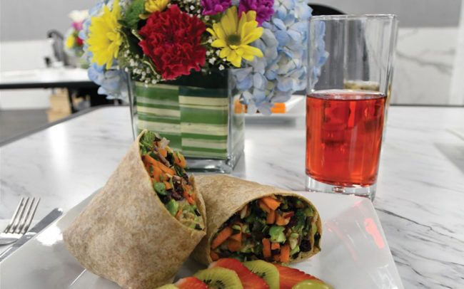 Healthy meal with vegetables and fruit on a dining table