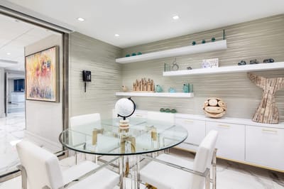 Modern interior common area with glass table and decor