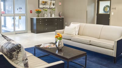 Cozy lobby area with comfortable seating and flowers