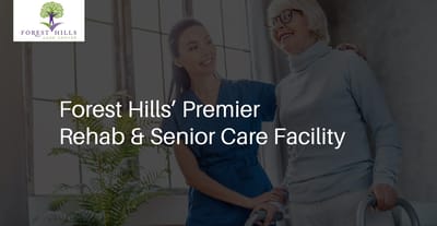 Staff assisting resident in a bright interior space