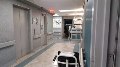 Interior hallway with accessible facilities and art