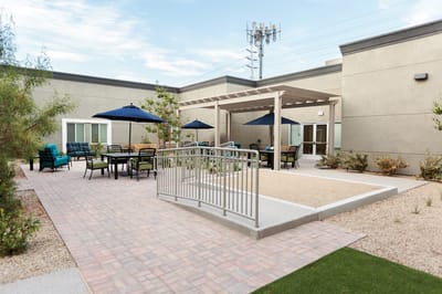 Outdoor gathering area with seating and shade