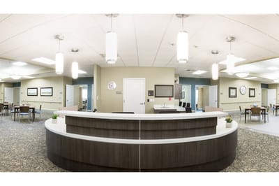 Bright common area with desks and seating