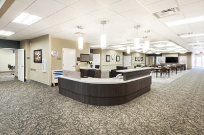 Bright interior common area with reception and seating