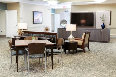 Bright interior common area with seating and tables