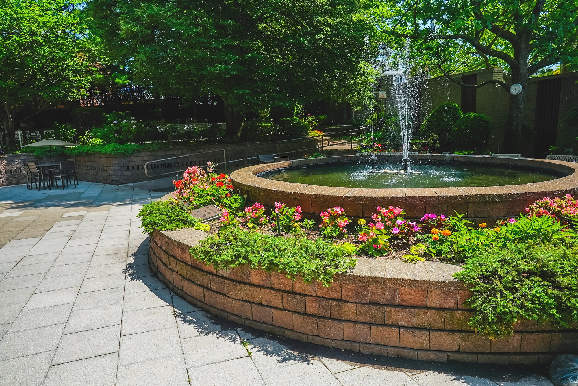 Beautiful outdoor space with fountain and flowers