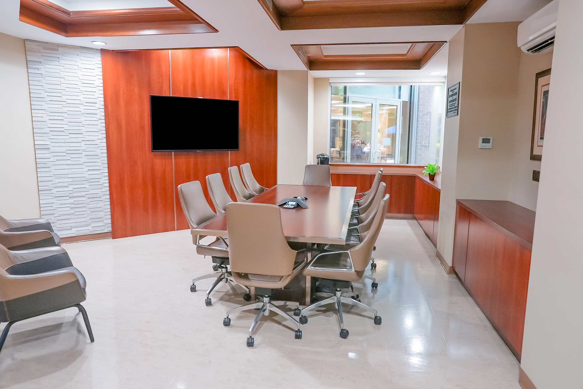 Modern conference room with wooden accents and seating