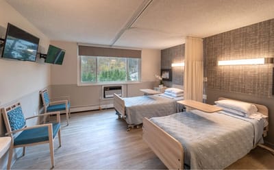 Interior view of a shared resident room with two beds